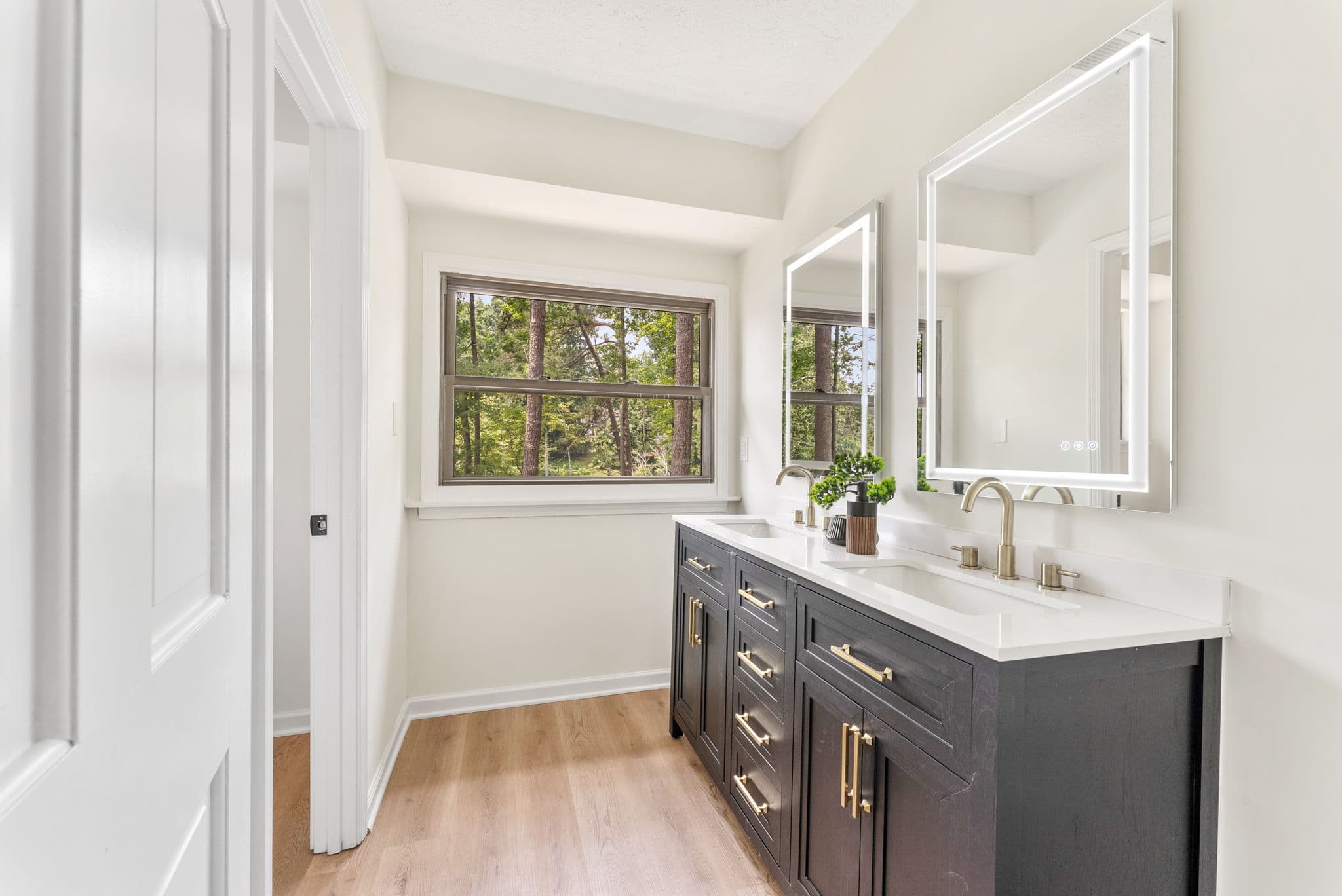 After: master bath double vanity with lighted mirrors