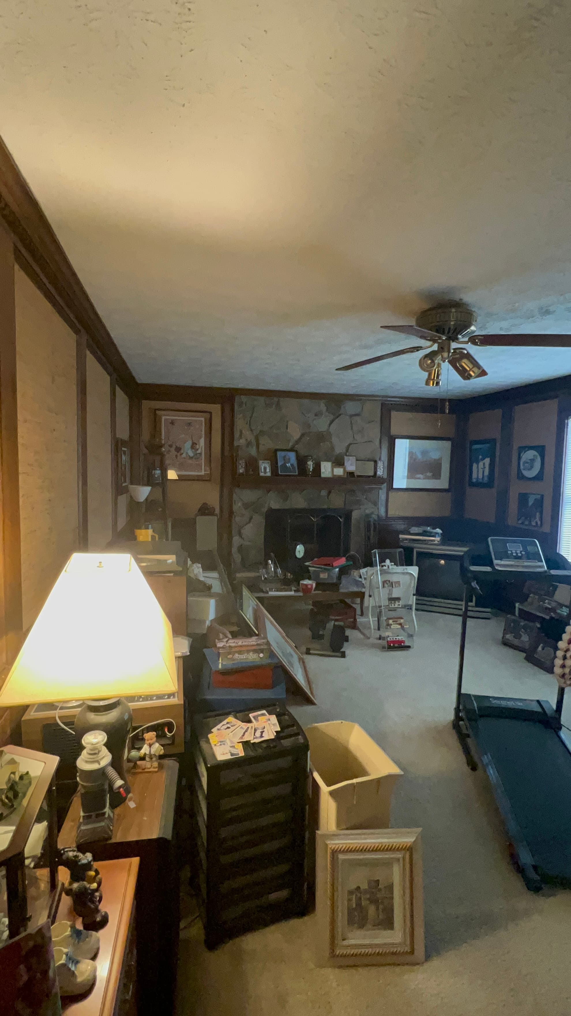 Before: dark wood-paneled living room