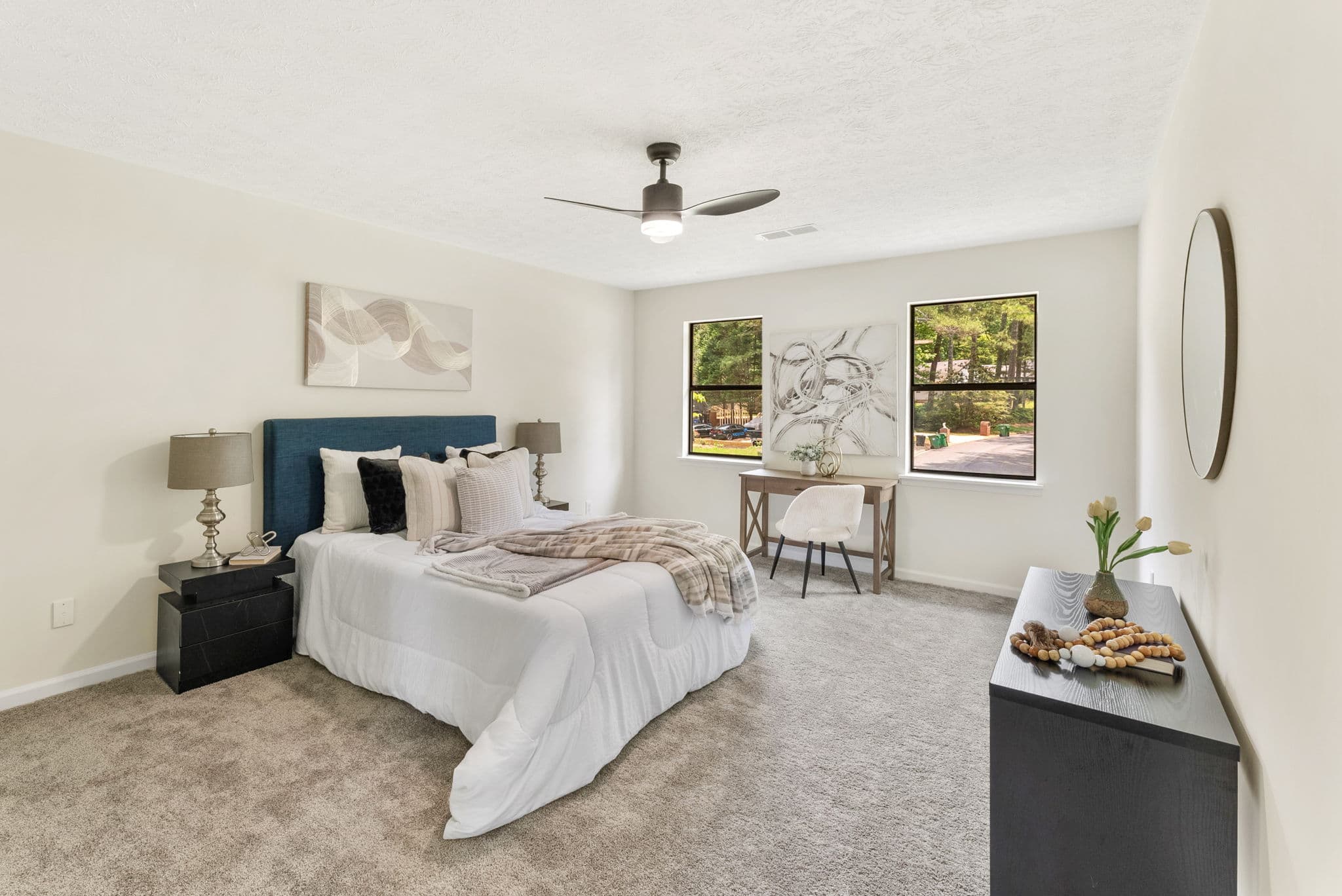 After: staged master bedroom with new carpet and paint